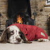 dog laying down in front of the fire wearing a drying towel coat by ruff and tumble sold by canmore canines